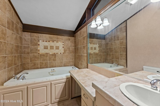 bathroom featuring a bathing tub, vanity, and lofted ceiling