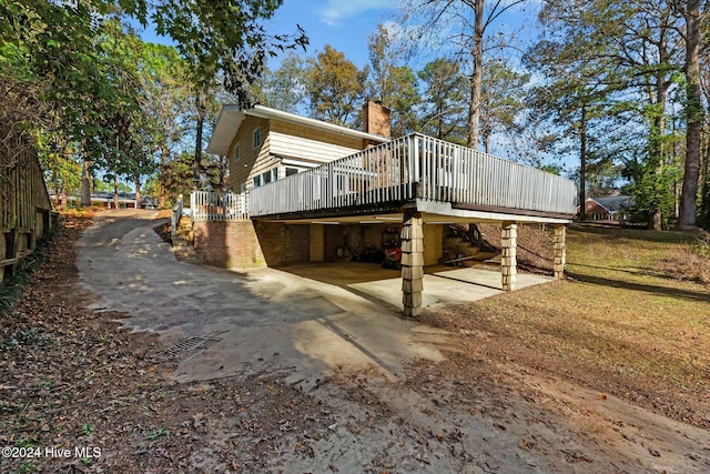 view of side of property featuring a deck