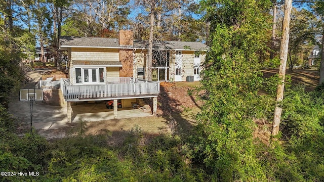 rear view of house featuring central AC, a patio, and a deck