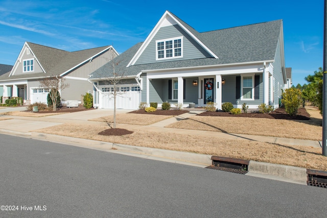 view of front facade featuring a garage and covered porch