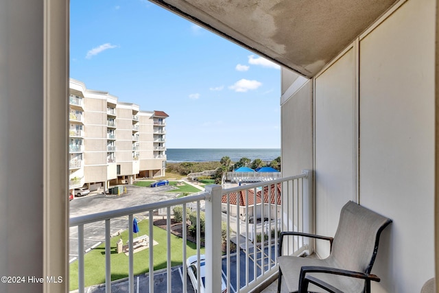 balcony featuring a water view