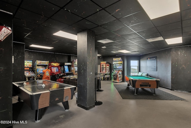 rec room with a drop ceiling, concrete flooring, and pool table