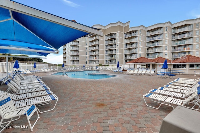 view of pool featuring a patio