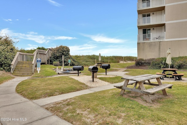 view of property's community with a yard