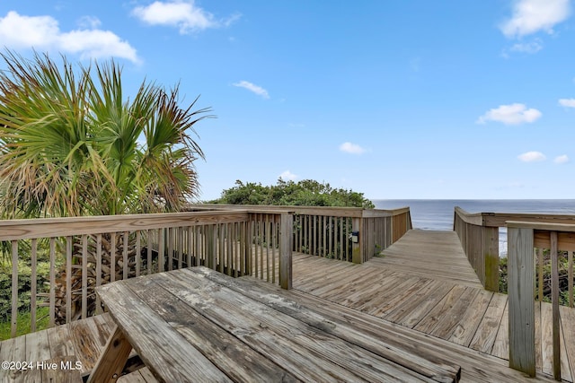 wooden deck with a water view