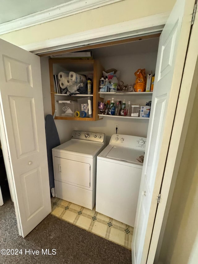 laundry area featuring carpet flooring and washing machine and dryer