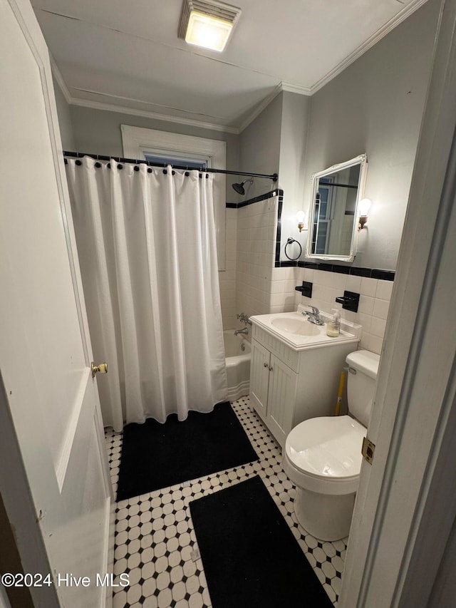 full bathroom with crown molding, toilet, shower / tub combo with curtain, vanity, and tile walls