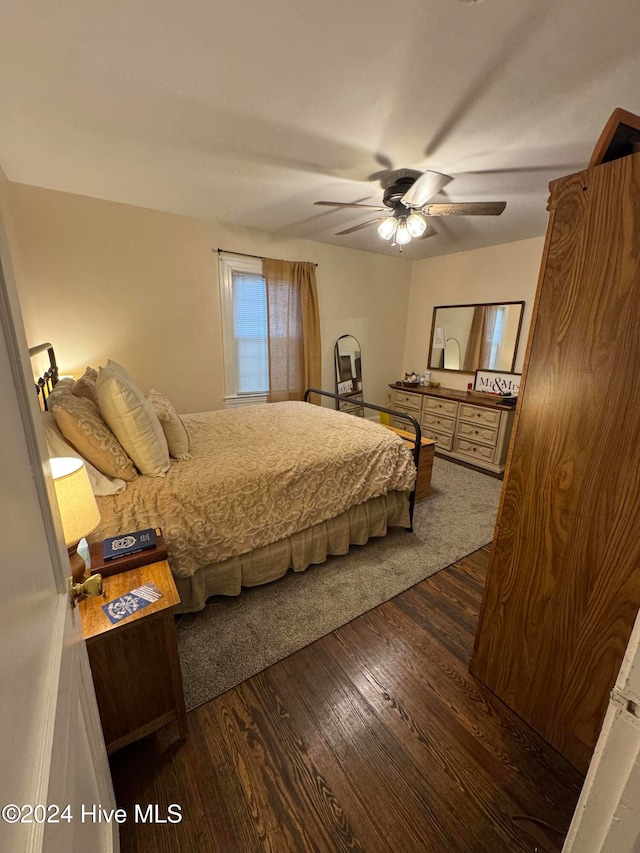 bedroom featuring ceiling fan and dark hardwood / wood-style flooring