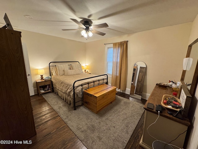 bedroom featuring ceiling fan and dark hardwood / wood-style flooring