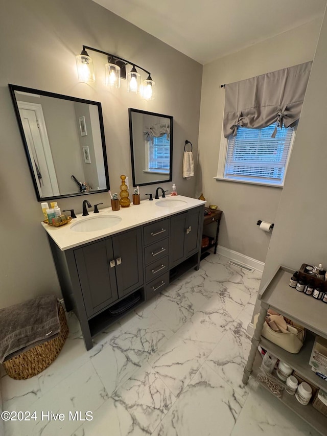 bathroom featuring vanity and ceiling fan