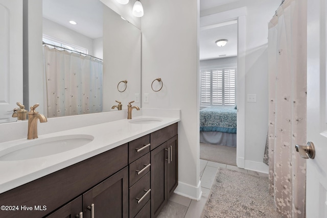 bathroom with vanity and tile patterned floors