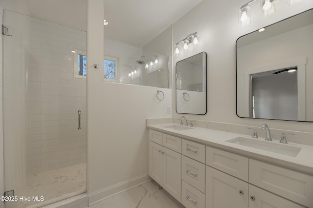 bathroom featuring walk in shower and vanity