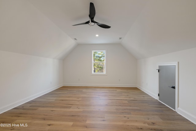 bonus room with ceiling fan, lofted ceiling, and light hardwood / wood-style flooring