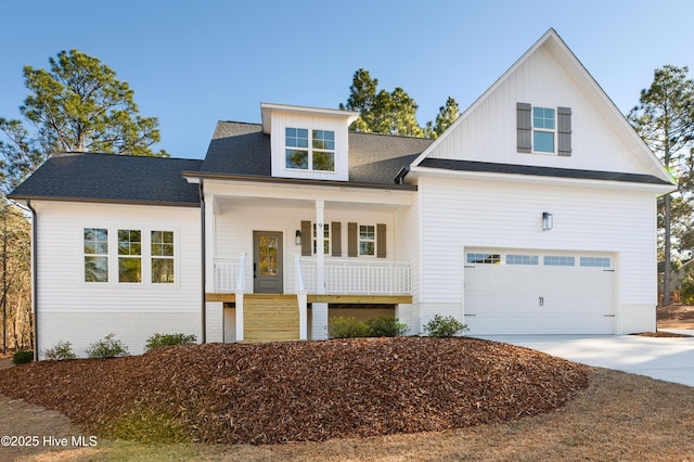 view of front facade featuring a garage and a porch