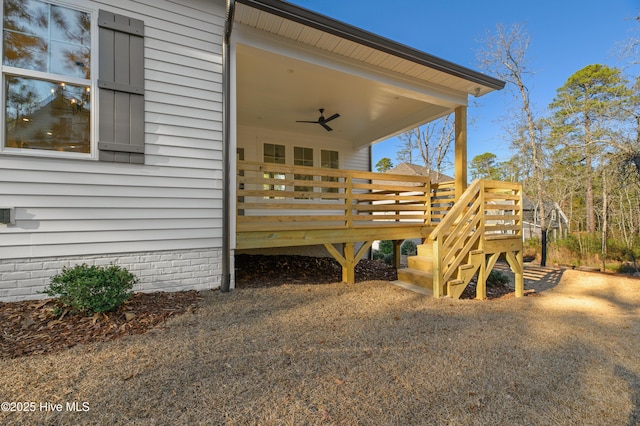 exterior space featuring ceiling fan and a wooden deck