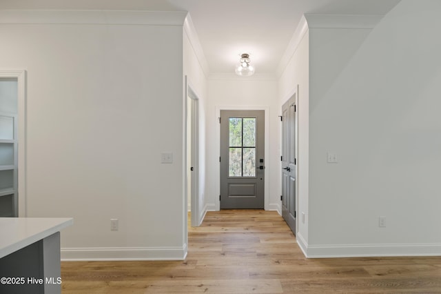 entryway featuring light hardwood / wood-style floors and crown molding