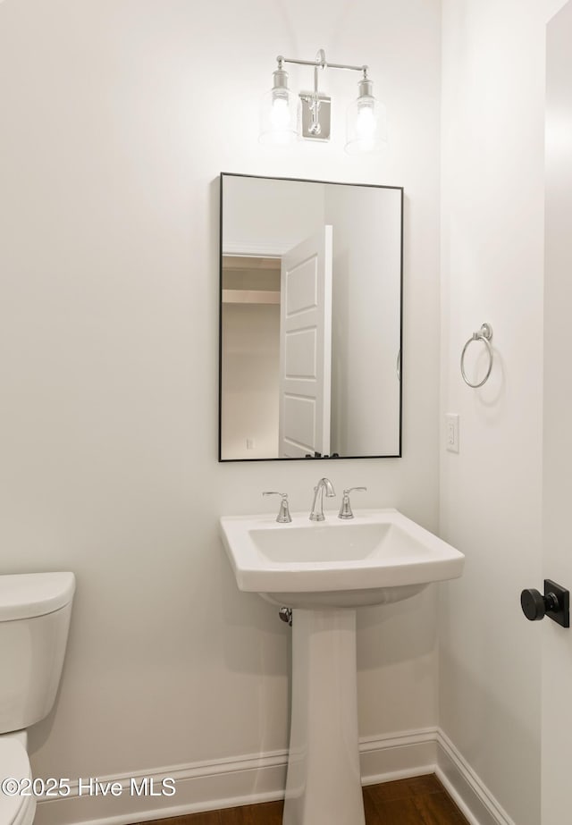 bathroom with toilet and sink