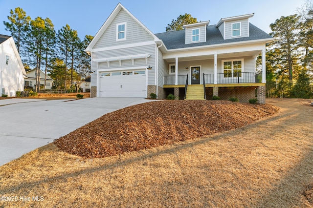 view of front facade with a garage and a porch