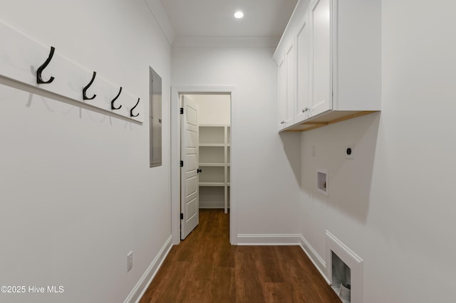 clothes washing area featuring hookup for an electric dryer, dark hardwood / wood-style floors, hookup for a washing machine, cabinets, and crown molding