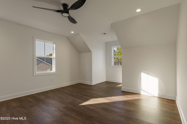 additional living space with ceiling fan, dark wood-type flooring, and lofted ceiling