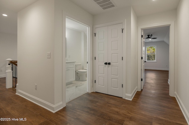 hall with dark wood-type flooring