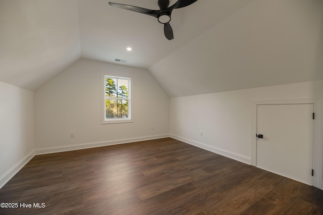 bonus room with ceiling fan, dark hardwood / wood-style floors, and vaulted ceiling