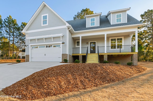 view of front of house featuring covered porch and a garage