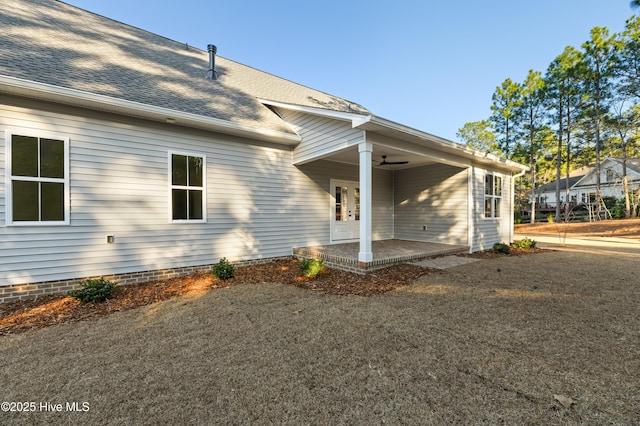 exterior space with ceiling fan and a patio area