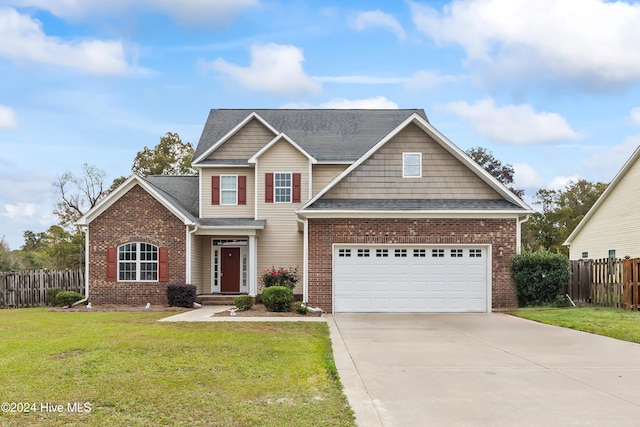 view of front of property with a garage and a front yard