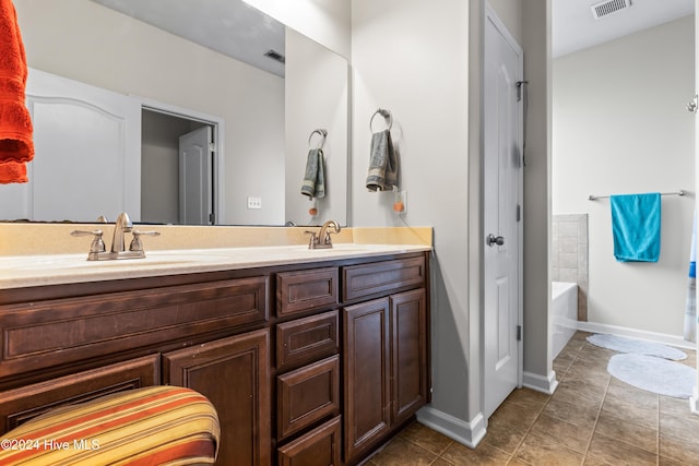 bathroom with a bathtub and vanity