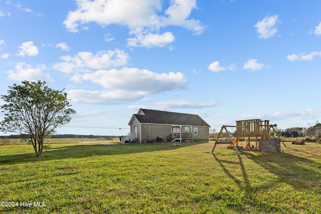 view of yard featuring a playground and a rural view