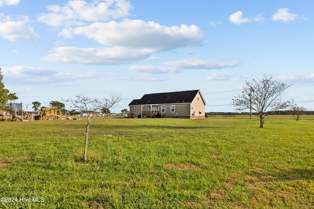 view of yard featuring a playground and a rural view