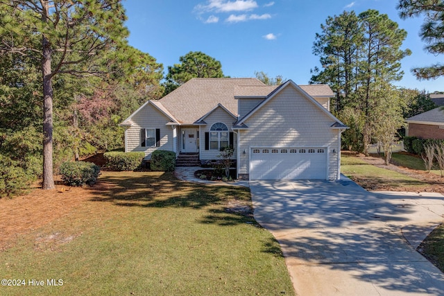 view of front facade featuring a front yard and a garage