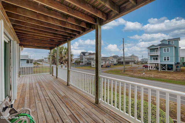 132 Reeves St, North Topsail Beach, NC 28460 - wooden deck with a residential view