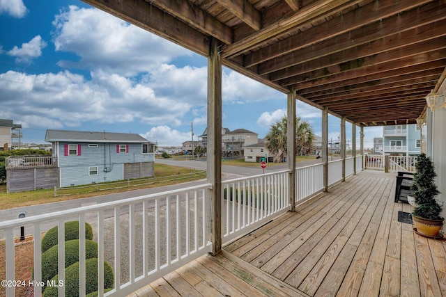 132 Reeves St, North Topsail Beach, NC 28460 - wooden deck with a residential view and a lawn