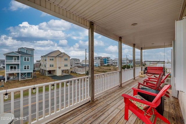 132 Reeves St, North Topsail Beach, NC 28460 - wooden deck featuring a residential view