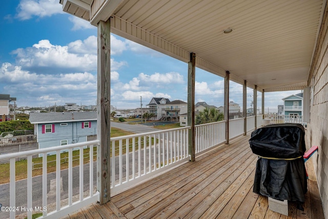 132 Reeves St, North Topsail Beach, NC 28460 - wooden deck with grilling area and a residential view