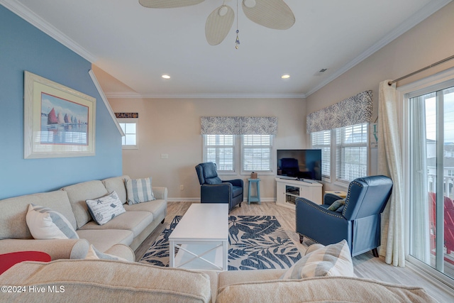 living room featuring ceiling fan, crown molding, and light hardwood / wood-style floors