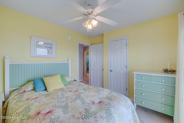 bedroom with carpet floors, a closet, and ceiling fan