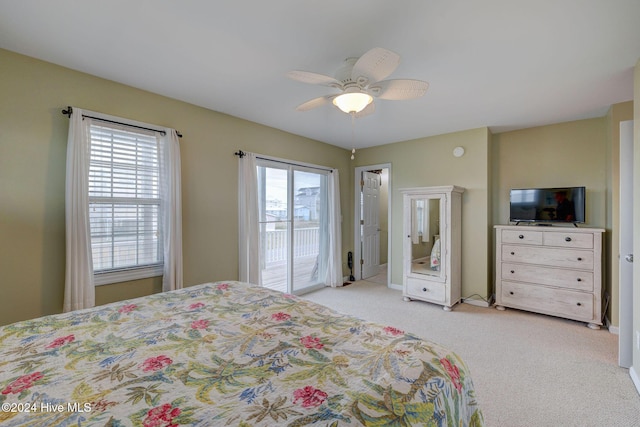 132 Reeves St, North Topsail Beach, NC 28460 - bedroom with access to exterior, light colored carpet, and a ceiling fan