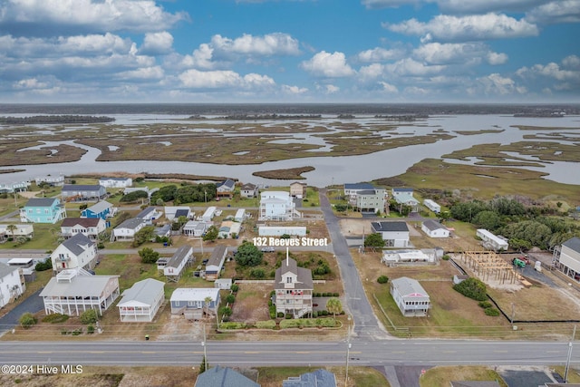 132 Reeves St, North Topsail Beach, NC 28460 - aerial perspective of suburban area with a nearby body of water