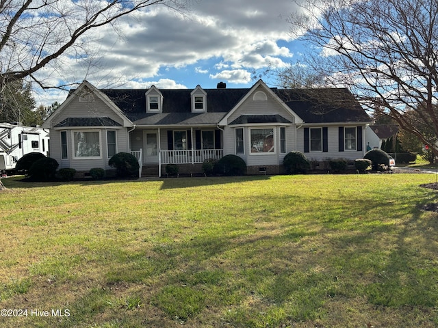 view of front of property with covered porch and a front lawn