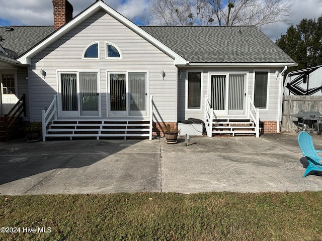 rear view of house with a patio