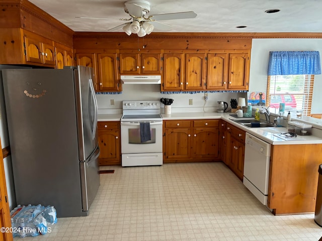 kitchen featuring ceiling fan, sink, and white appliances