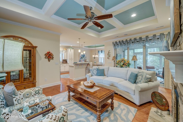 living room featuring coffered ceiling, crown molding, and light hardwood / wood-style flooring