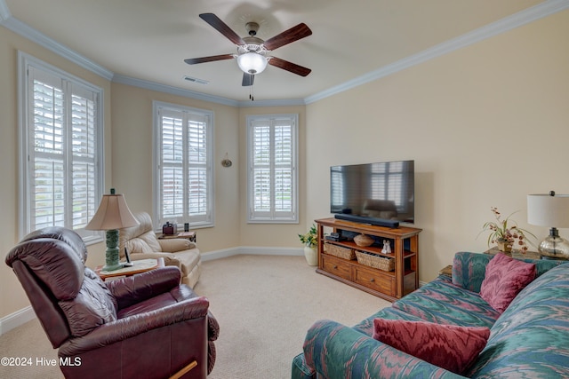 living room with crown molding, plenty of natural light, and light colored carpet