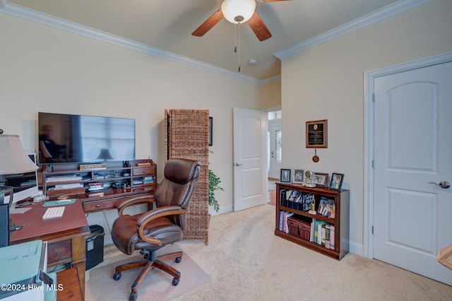 carpeted home office with ceiling fan and ornamental molding