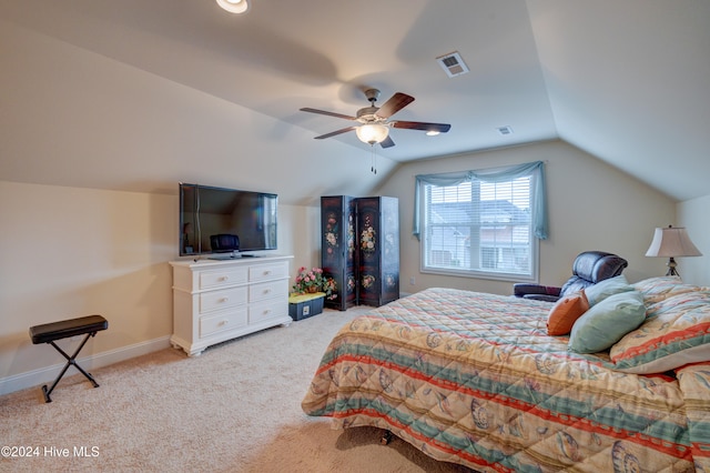 carpeted bedroom with vaulted ceiling and ceiling fan