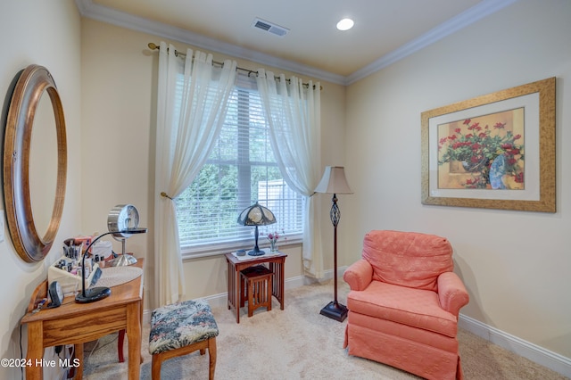 living area featuring carpet flooring and ornamental molding