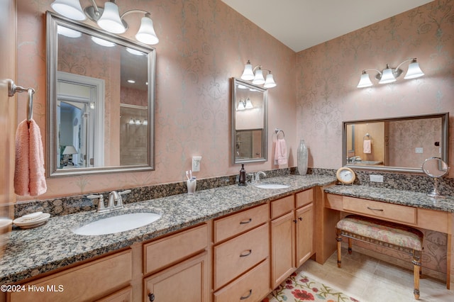 bathroom featuring tile patterned floors, vanity, and walk in shower